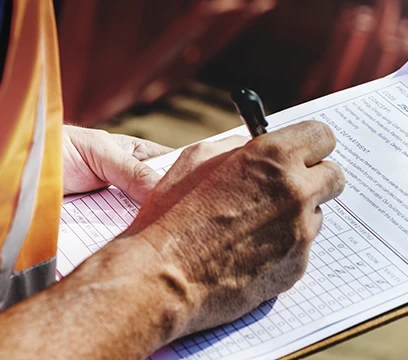 man writing a safety assessment