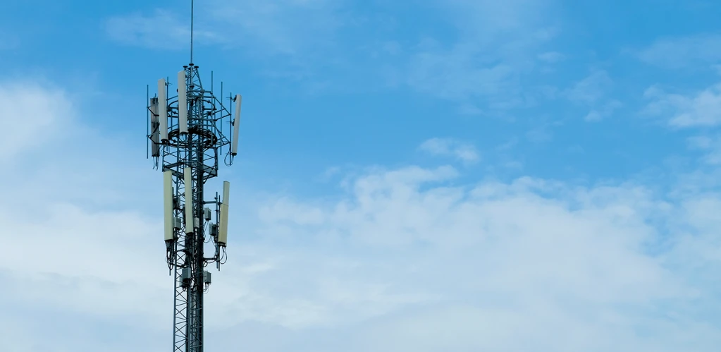 macro cell site tower with blue sky